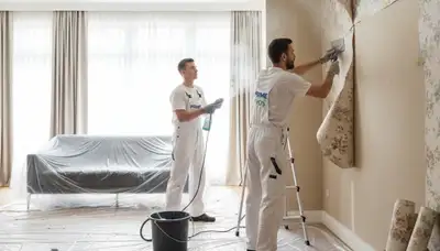 Professional wallpaper removal service in Tampa FL preparing walls for new paint or finish